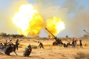 anti-gaddafi-fighters-fire-130mm-howitzers-at-pro-gaddafi-forces-near-east-of-sirte